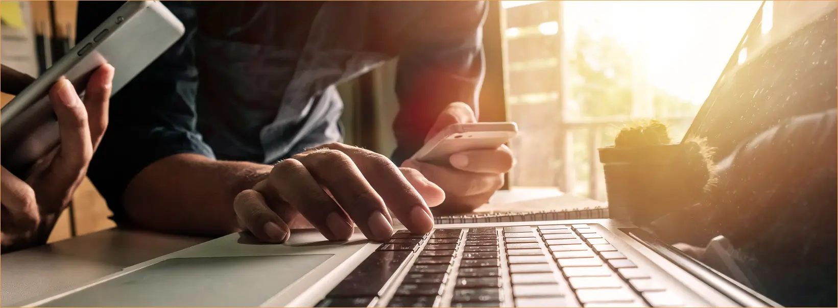 hands typing on laptop